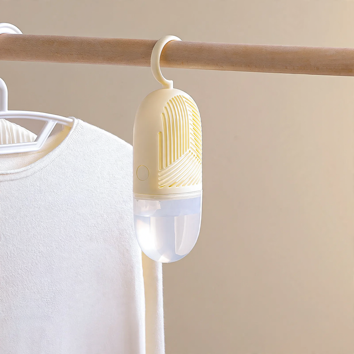 Hanging dehumidifier bag for wardrobes