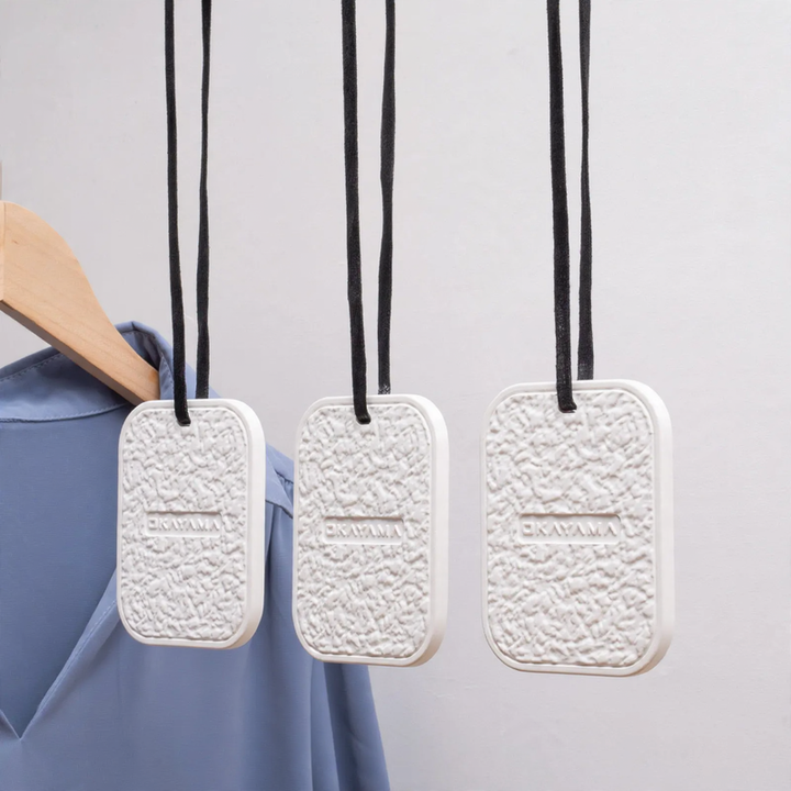 Hanging diatomaceous earth dehumidifier for cabinets