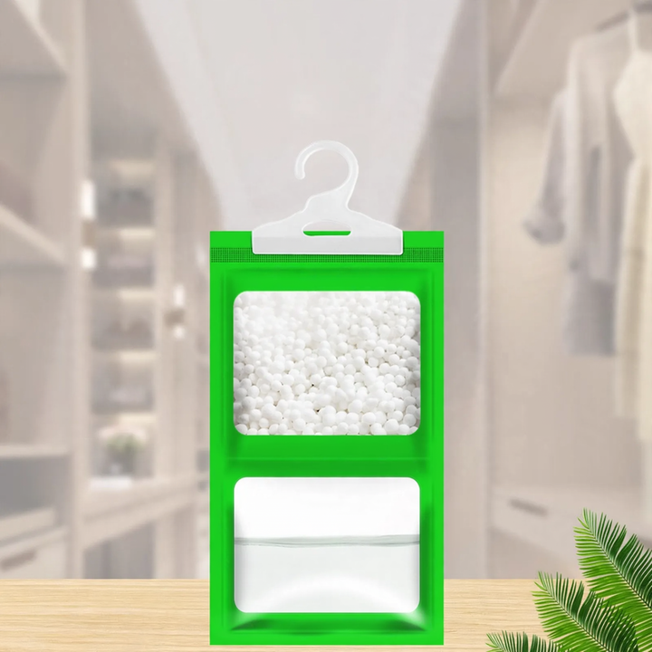 Hanging dehumidifying bag for wardrobes
