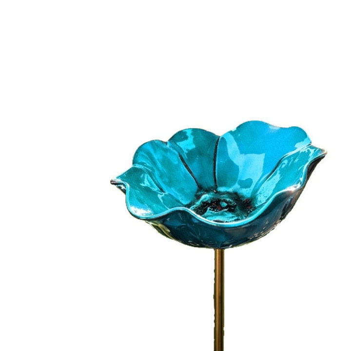 Decorative bird feeder made of metal in flower shape