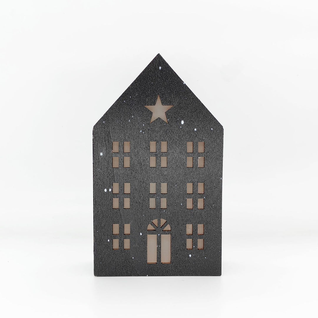 Christmas wooden house with lighting as table decoration