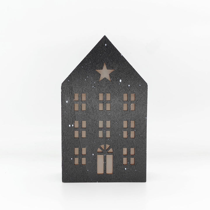 Christmas wooden house with lighting as table decoration