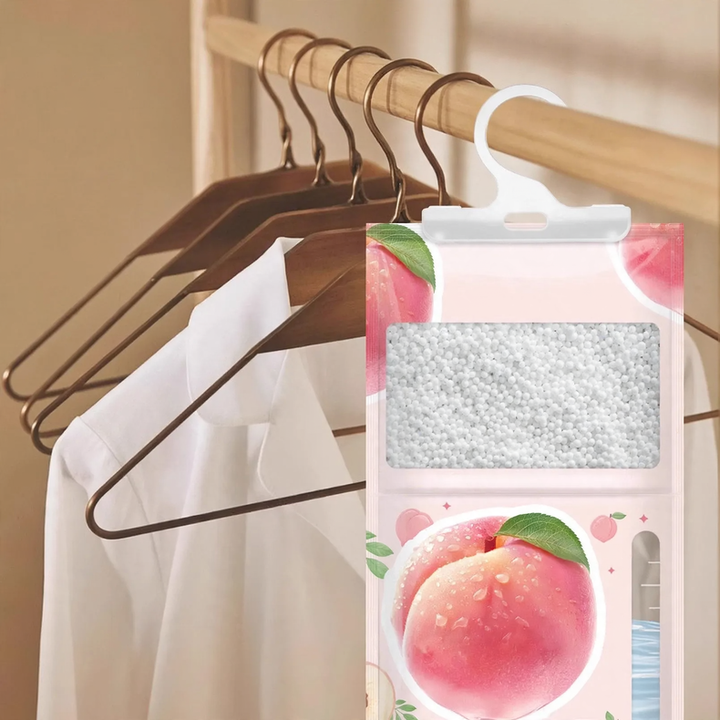 Hanging dehumidifying bag with fragrance note