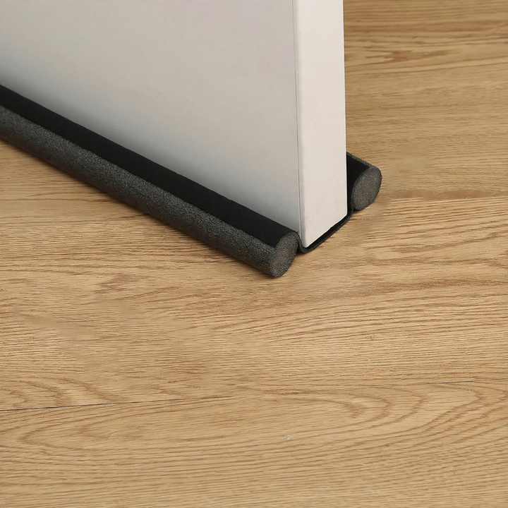 Door bottom seal for sound insulation and draft protection