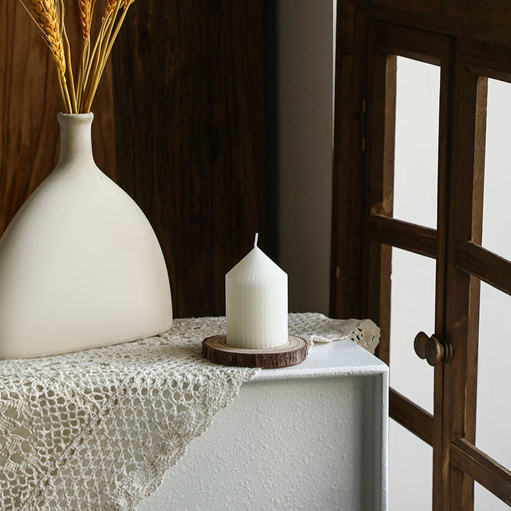 White tapered candle with striped pattern, Nordic