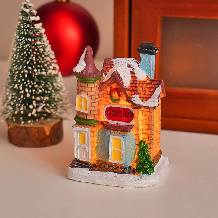 Illuminated Christmas cottage made of resin