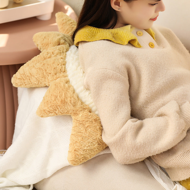 Decorative cuddle cushions with moon, star, and sun motif