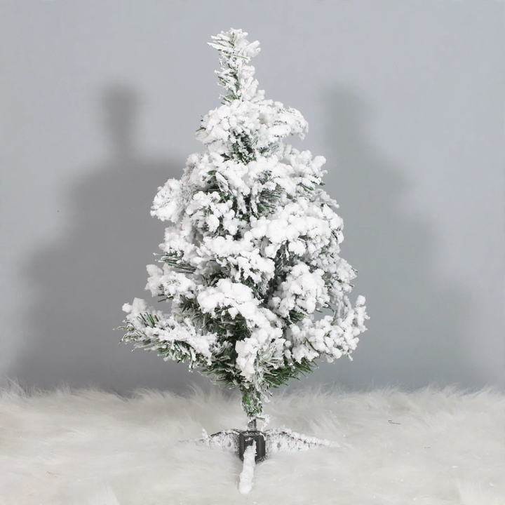 Mini Christmas tree for the table, snow-covered, with lighting