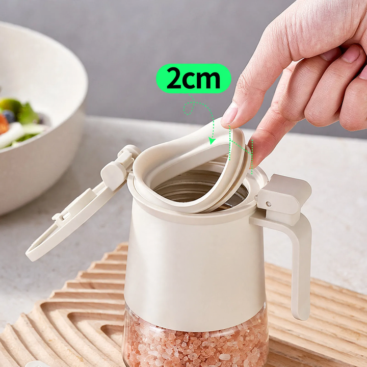 Sealed spice container made of glass with spoon