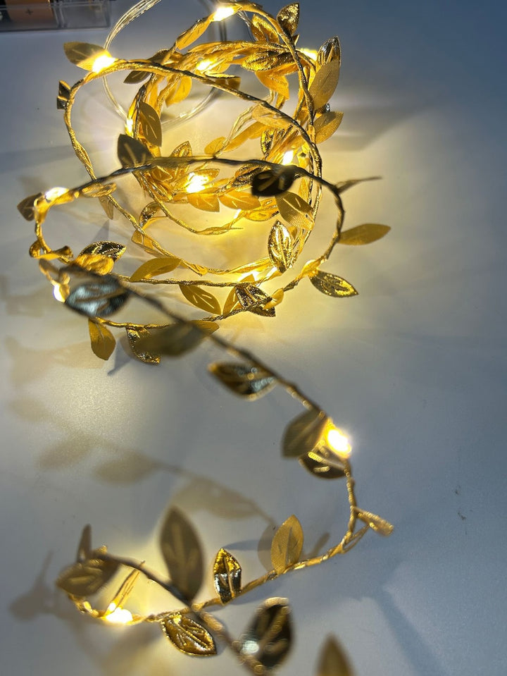 LED light chain with artificial leaves