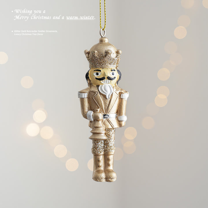 Golden nutcracker pendant made of resin for the Christmas tree