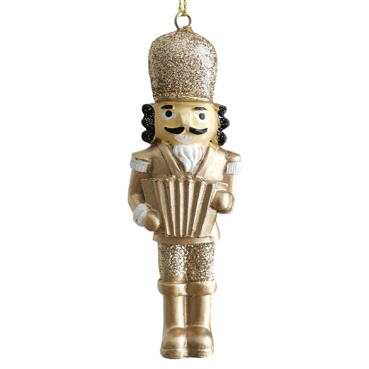 Golden nutcracker pendant made of resin for the Christmas tree
