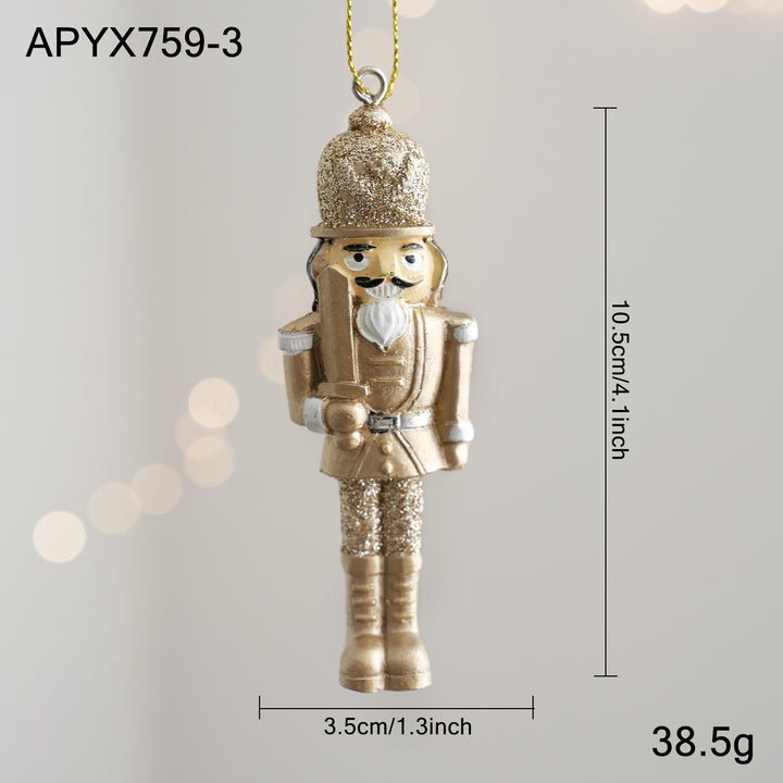 Golden nutcracker pendant made of resin for the Christmas tree