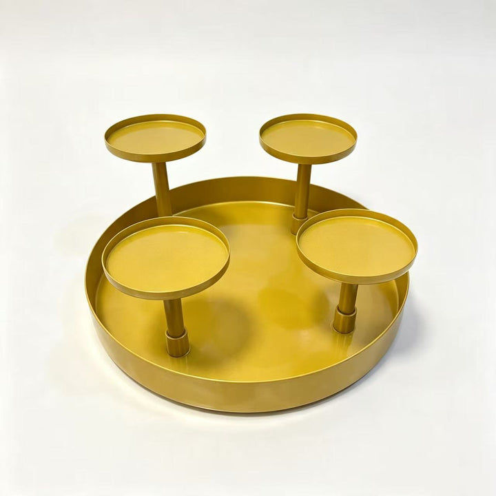 Four-armed metal candle holder for festive table decoration