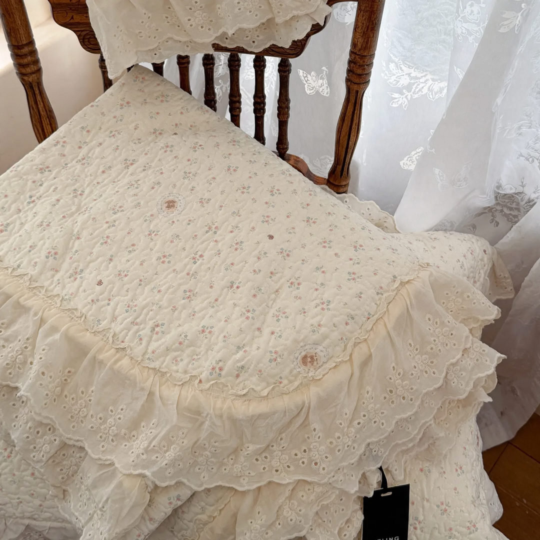 Cotton bedspread with lace trim, quilted