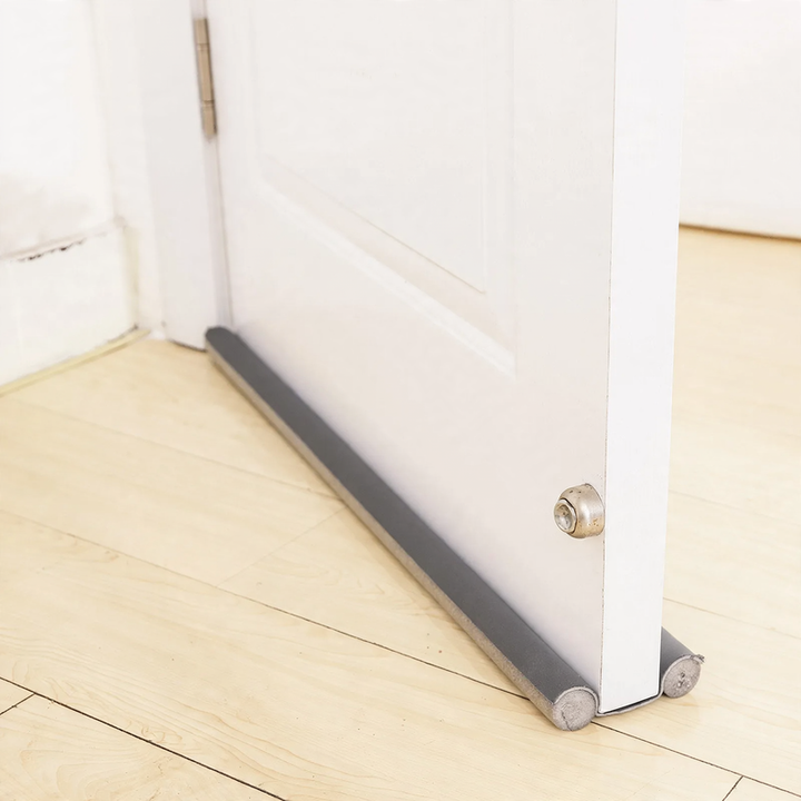 Door bottom seal for sound and draft protection