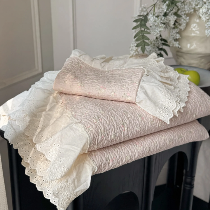Cotton bedspread with lace trim, quilted