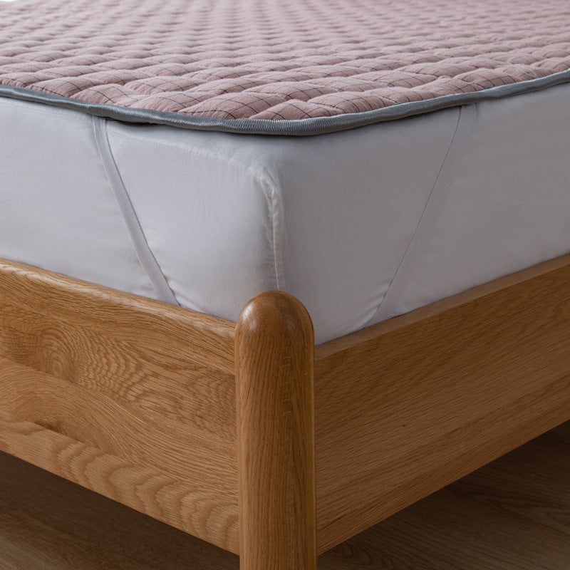 Padded mattress protector-topper with quilting and non-slip underside