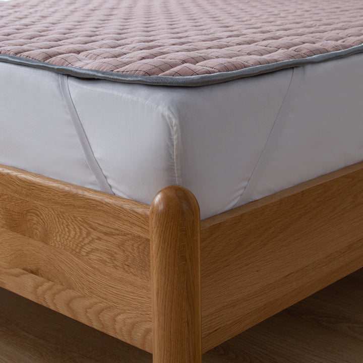 Padded mattress protector-topper with quilting and non-slip underside