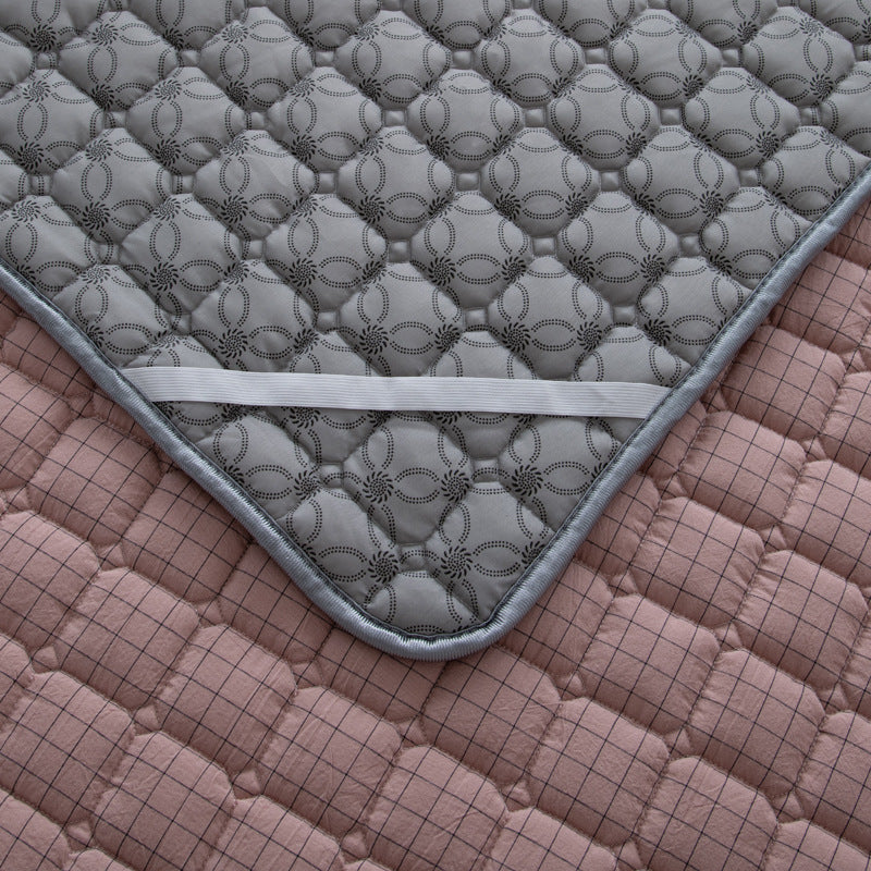 Padded mattress protector-topper with quilting and non-slip underside