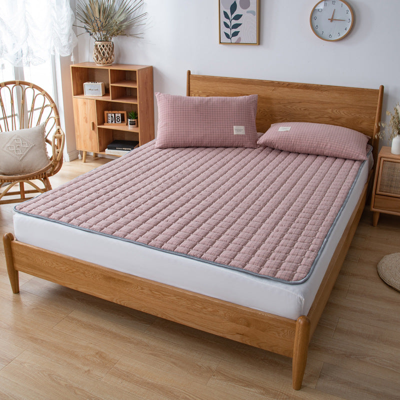 Padded mattress protector-topper with quilting and non-slip underside
