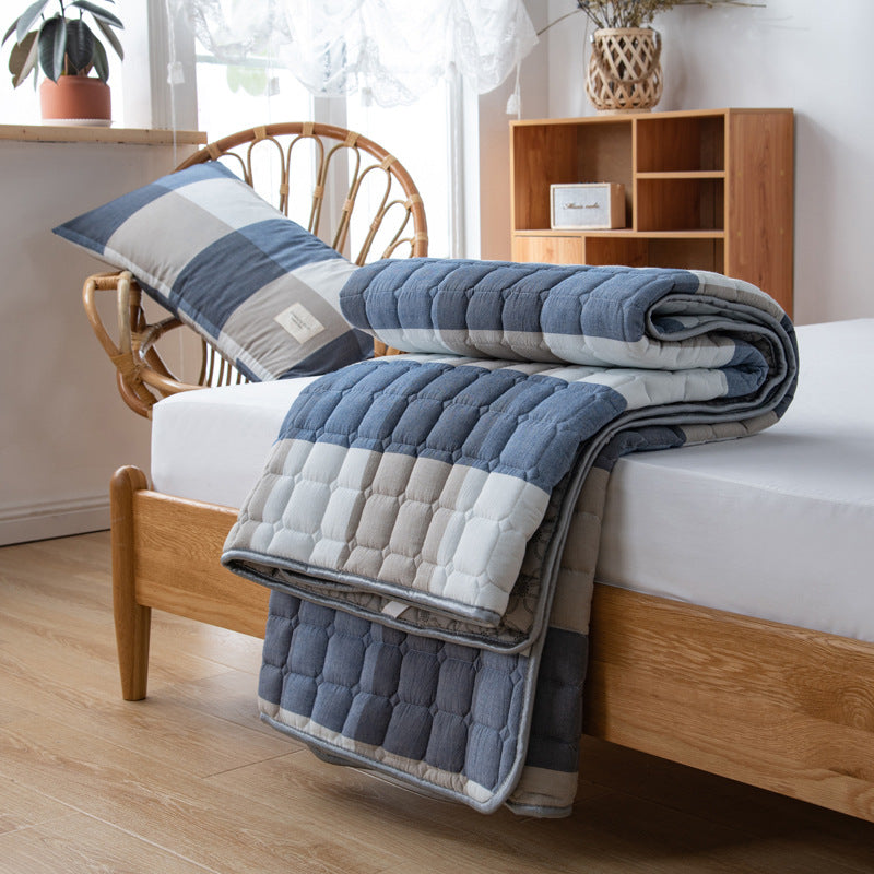 Padded mattress protector-topper with quilting and non-slip underside
