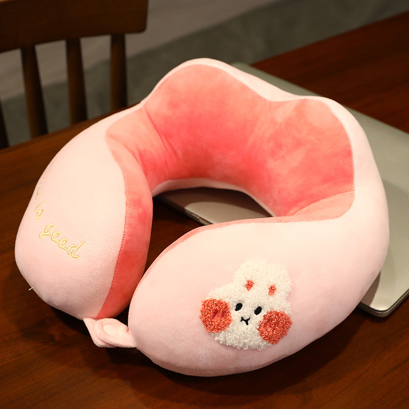 Plush neck travel pillow with ergonomic U-shape, snap button closure and adorable embroidery