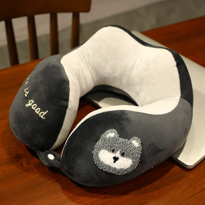 Plush neck travel pillow with ergonomic U-shape, snap button closure and adorable embroidery