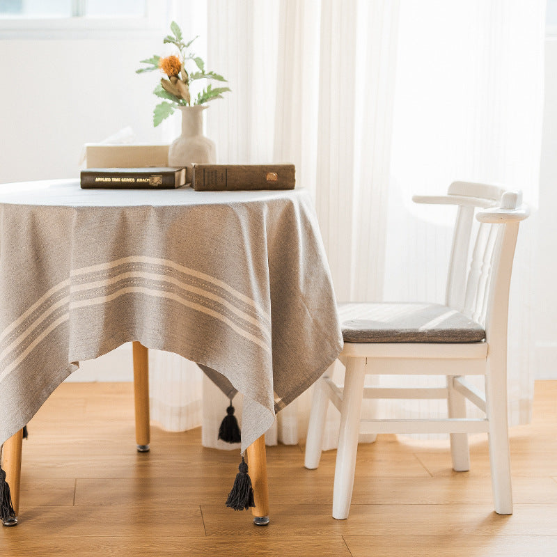 Rectangular linen look tablecloth with fringed tassels and side stripe border design Bowlift