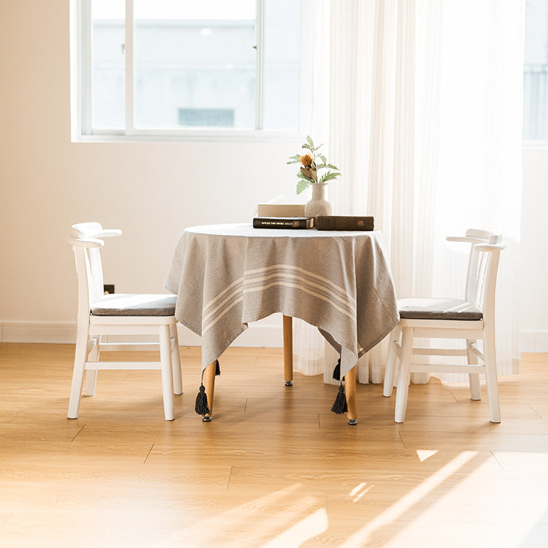 Rectangular linen look tablecloth with fringed tassels and side stripe border design Bowlift