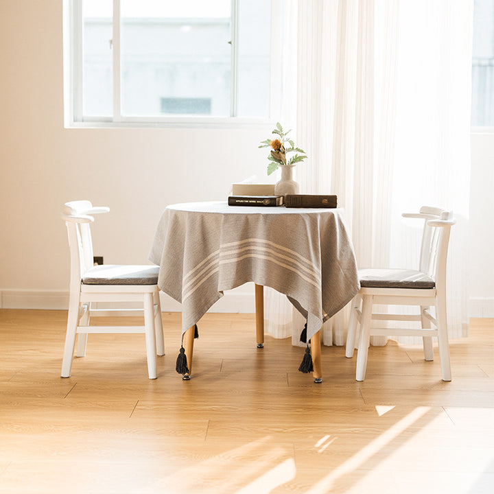 Rectangular linen look tablecloth with fringed tassels and side stripe border design Bowlift