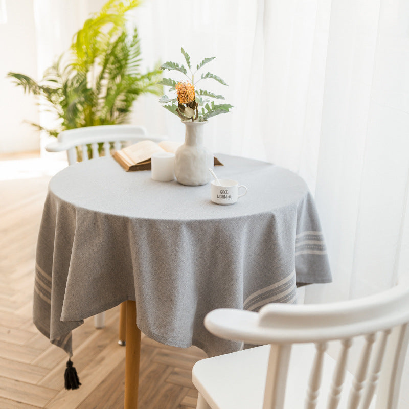 Rectangular linen look tablecloth with fringed tassels and side stripe border design Bowlift