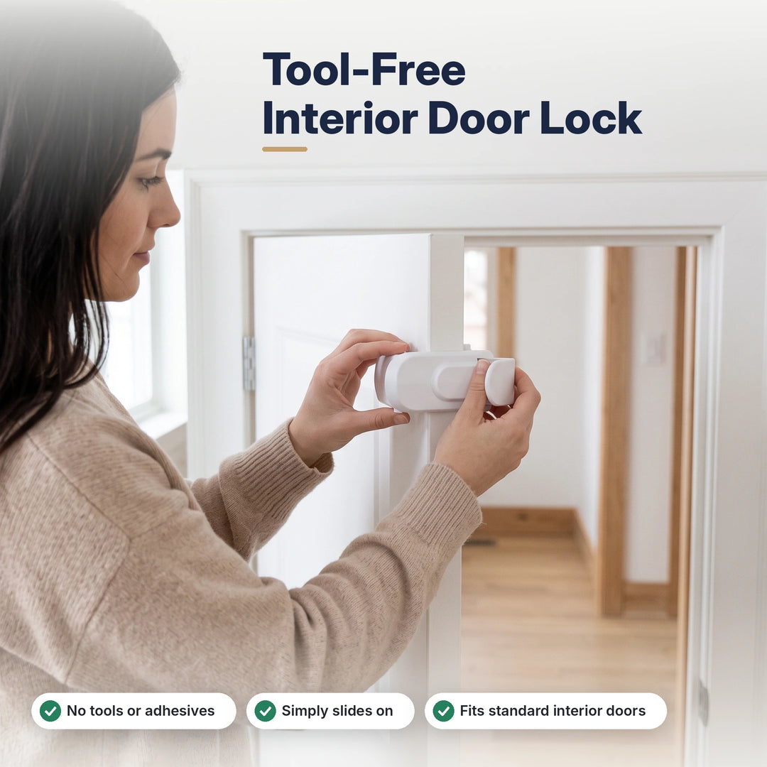 Woman sliding a white child safety lock onto the edge of an interior door