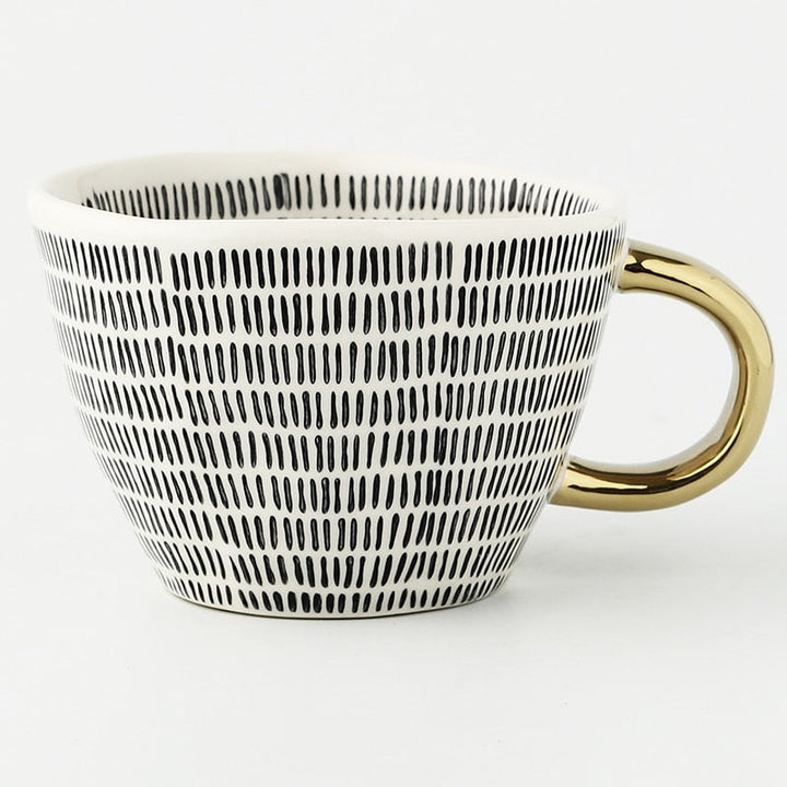BowLift | Cup with abstract geometric pattern and gold handle