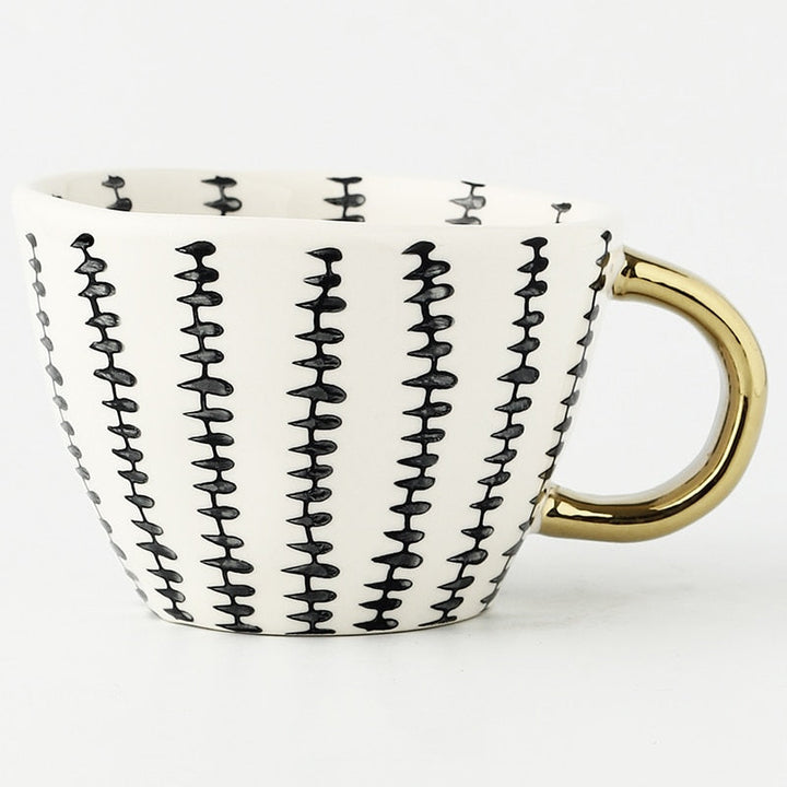 BowLift | Cup with abstract geometric pattern and gold handle