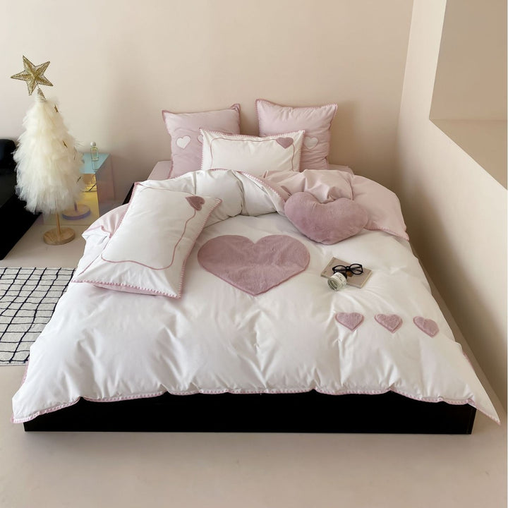 Bedding set with appliquéd plush hearts and fine piping