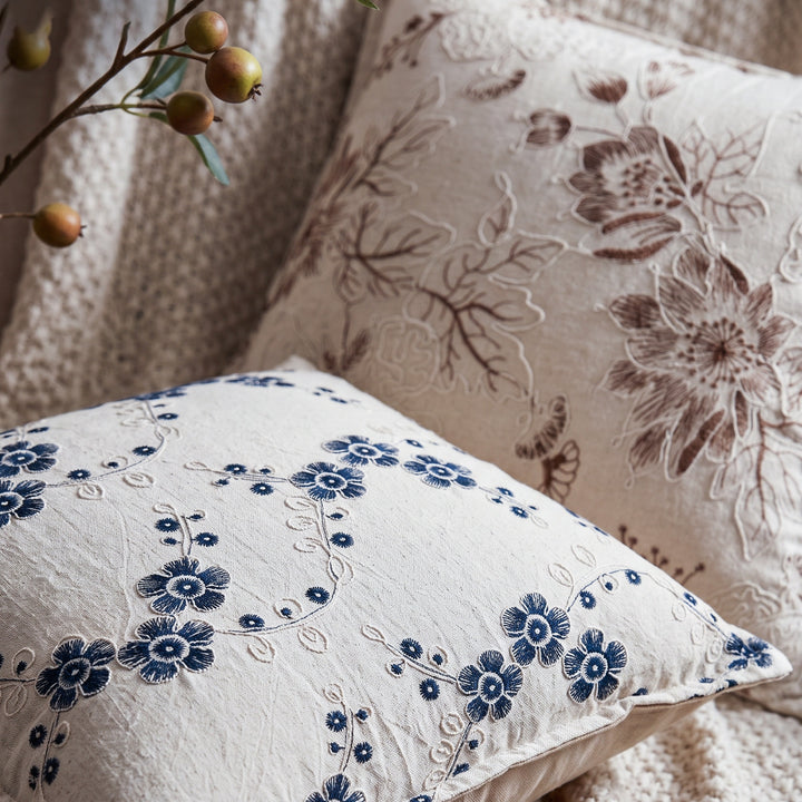 Decorative cushion with floral embroidery design