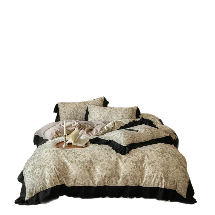 Bedding set with floral toile design and black ruffle