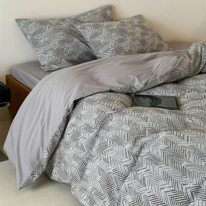 Bedding set made of washed cotton satin with a textured houndstooth pattern and reversible function