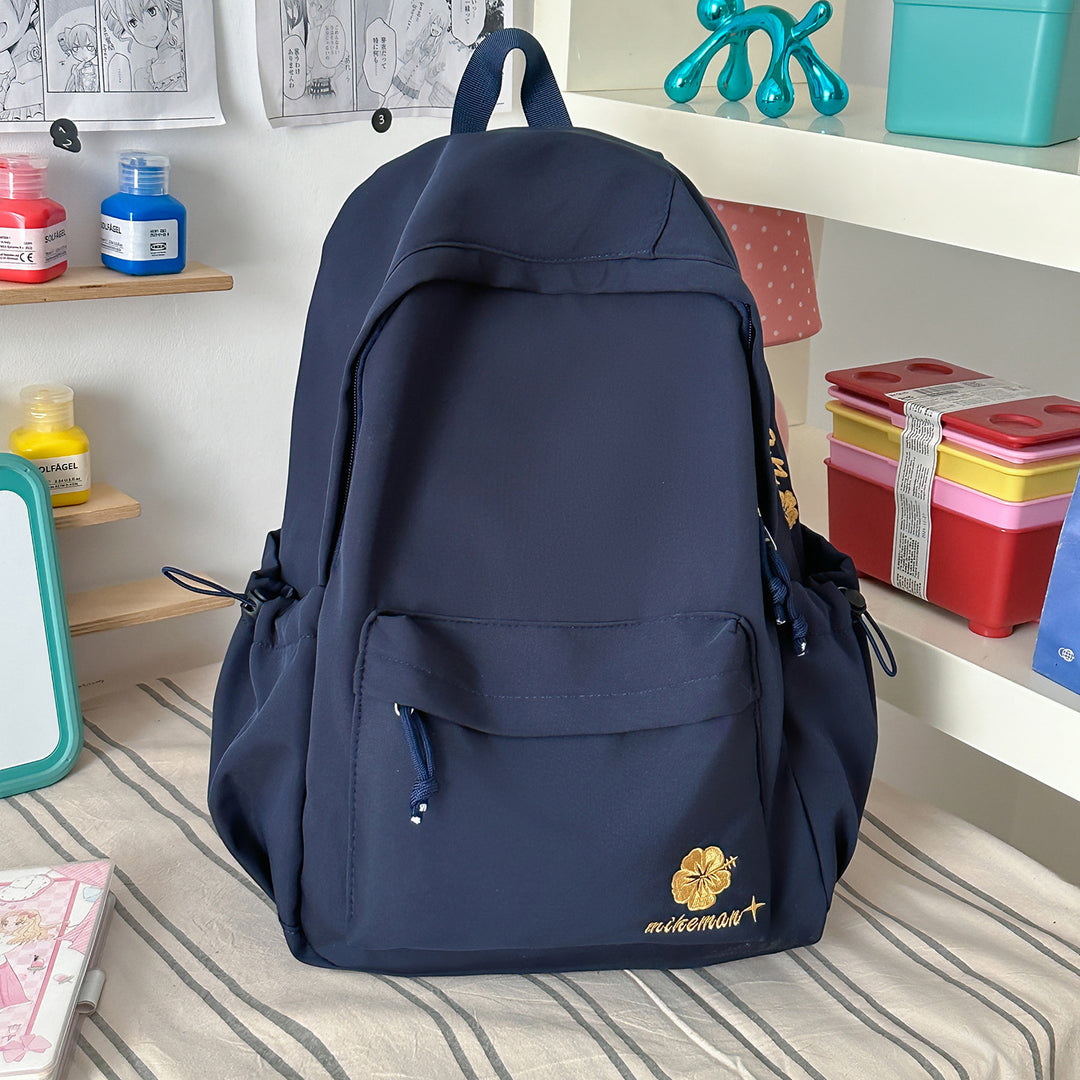 Versatile Lightweight Backpack with Decorative Accents Bowlift