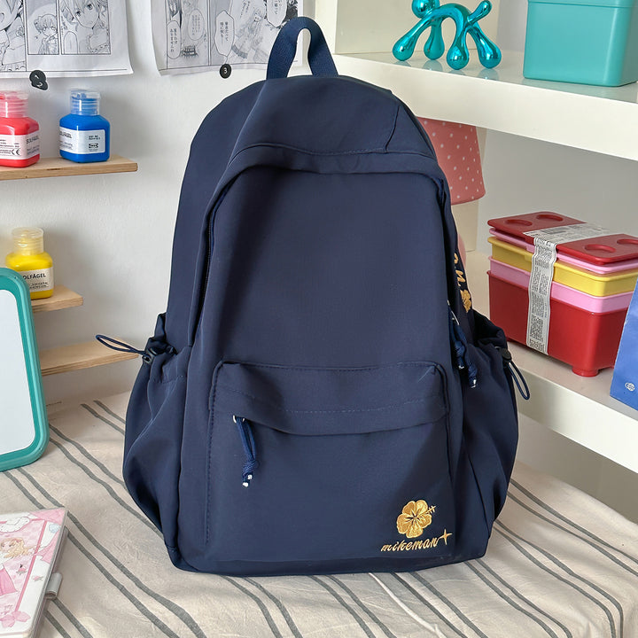 Versatile Lightweight Backpack with Decorative Accents Bowlift