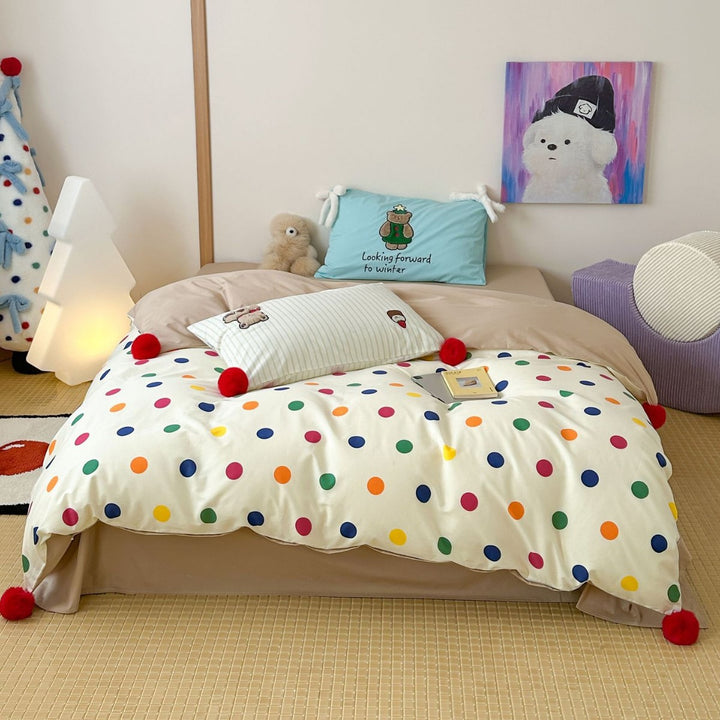 Playful cotton bedding set with pompom trim and embroidered rabbit motif