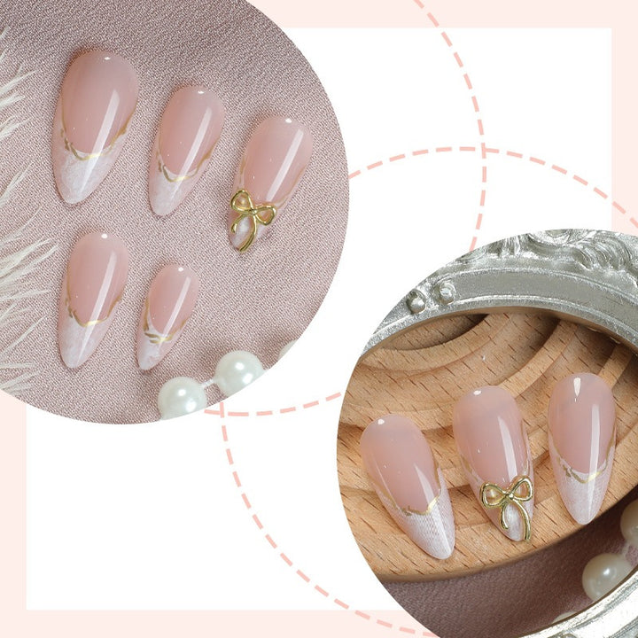 Acrylic nail set with elegant tips and gold embellishments Bowlift