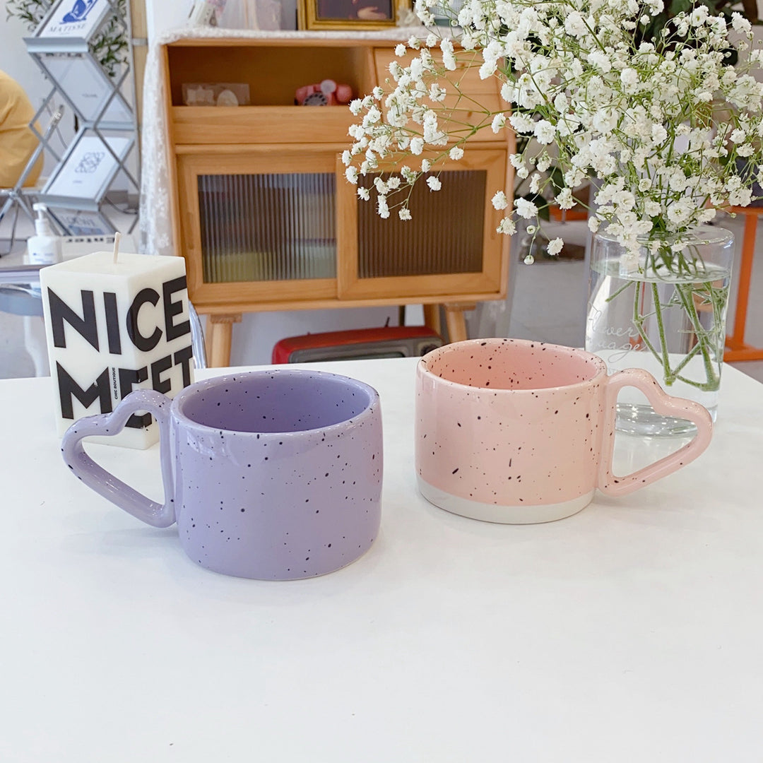Oversized ceramic mug with heart-shaped handle and dotted glaze