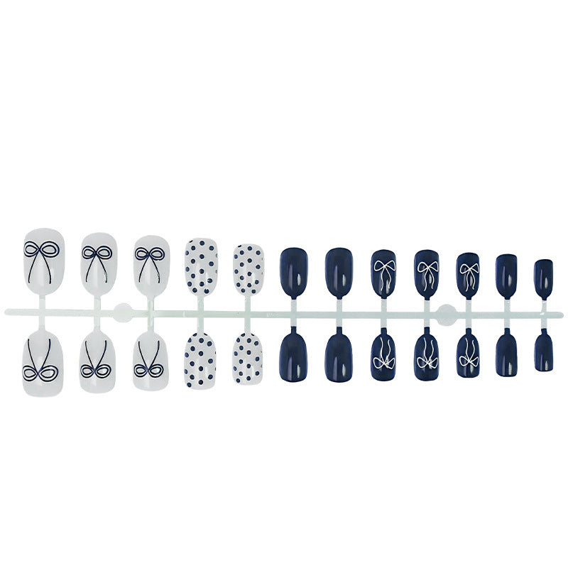 Nail set with stylish bows and dots Bowlift