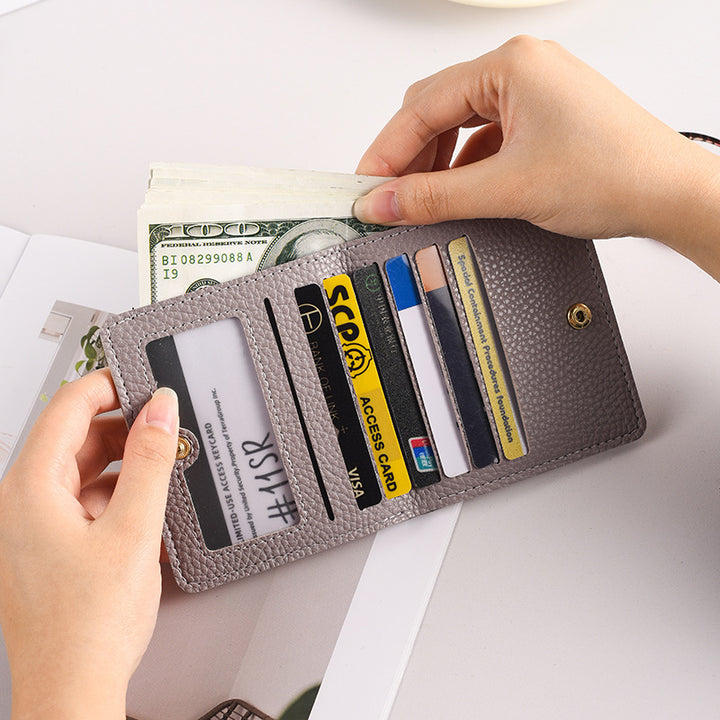 Compact Pebbled Leather Bifold Wallet with Card Slots and Coin Pocket Bowlift