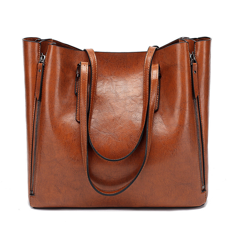 Versatile Leather Tote Bag with Zippered Pockets