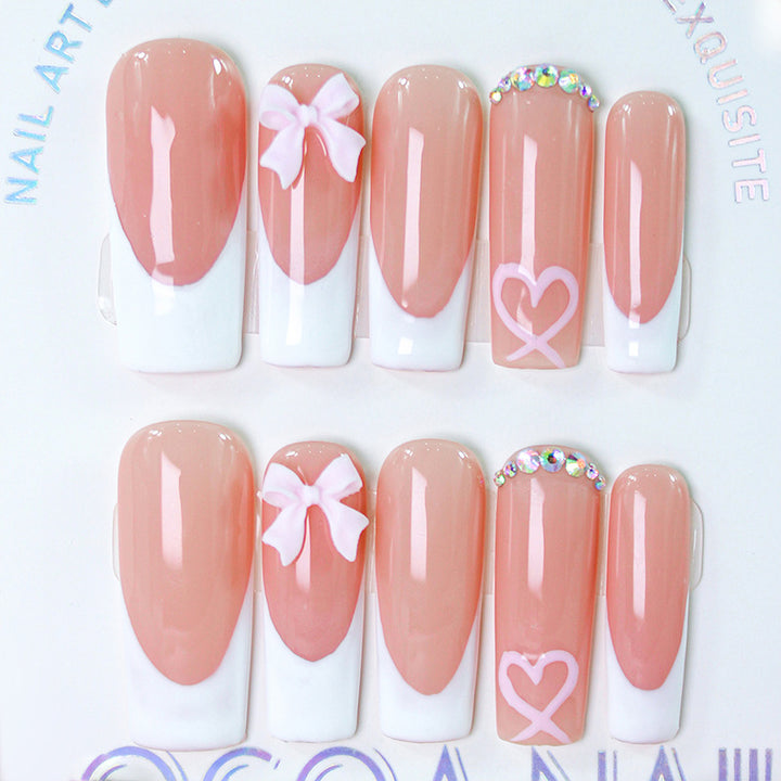 Artifical nail set with playful bow and heart designs Bowlift