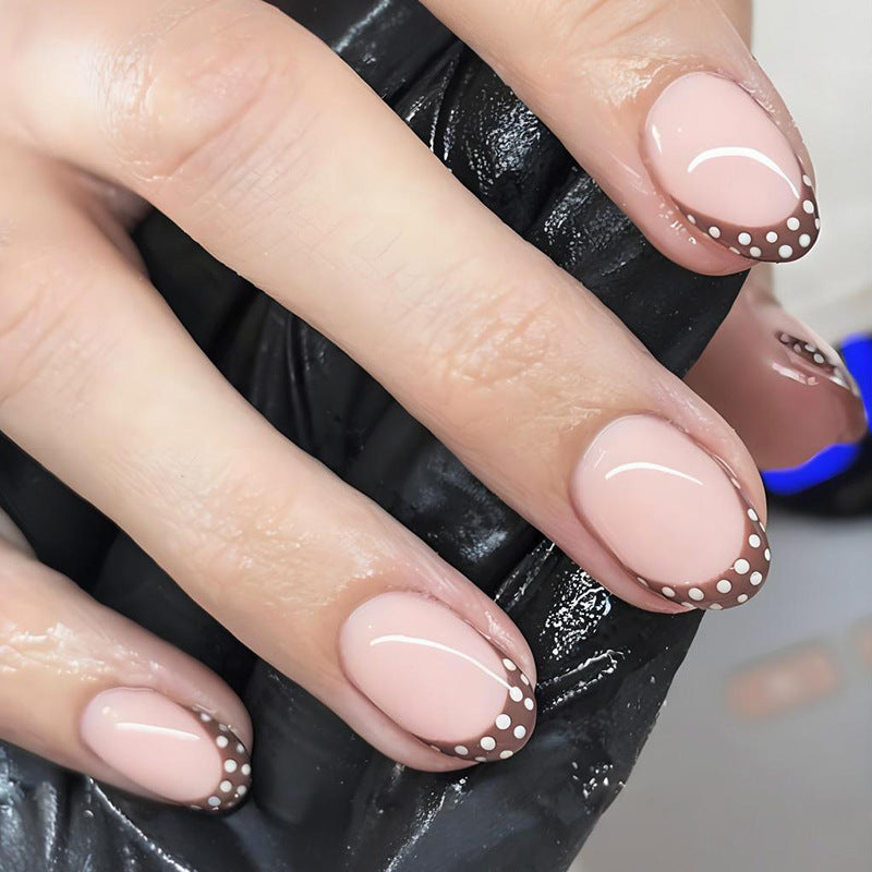 Artificial nail set with elegant French tips and subtle dots Bowlift