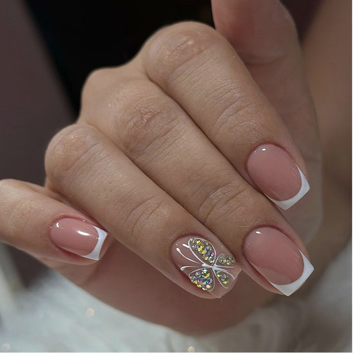 Artifical nail set with sparkling accents and elegant bows Bowlift